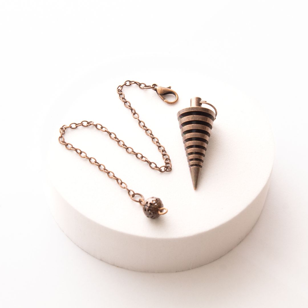 Péndulo Vórtice Cobre Antiguo